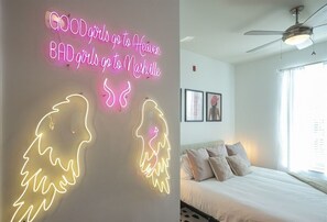 Fun bedroom with neon sign