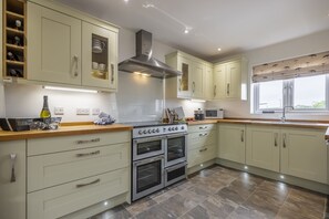 Ground floor:  Kitchen with electric range cooker