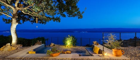 Lounge corner with an oak tree shade and spectacular sea views, which makes this a perfect spot for a glass of vine.