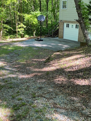 Driveway leads you to a lower level where there is a private parking area.