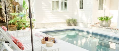 Beautiful pool with chaise lounges and umbrellas.