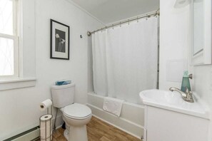 the bathroom is roomy, freshly renovated, and always sparkling clean.