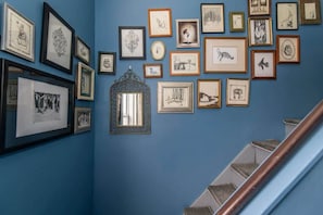 a selection of art from a local artist decorates the space, prints of her work are available at Scout Coffee located less than block from the unit.