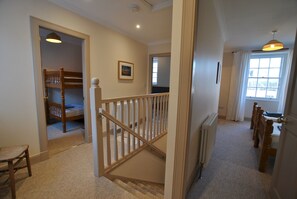 The bedrooms are grouped around the staircase