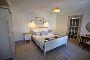 The spacious main bedroom offers plenty of storage