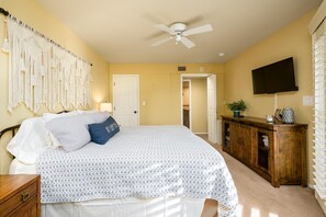 Large bedroom with smart TV.