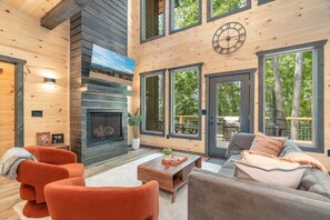 Living room luxury that opens to second floor with plenty of natural light