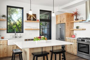 Gourmet kitchen with over-sized island dining area