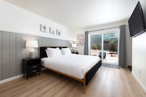 The large master suite offers plenty of room, a TV and walk-in closet.