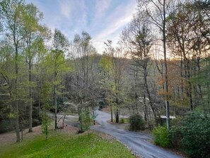 Spring sunset from screened in deck overlooking the half acre lot & ridgeline.