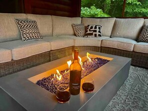 Cozy firepit in the screened porch to enjoy good times...rain or shine.