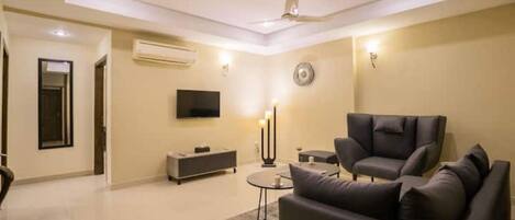 Lounge with Seating/ Dining Area, Hallway and TV Entertainment System