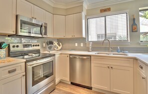 Kitchen has stainless steel appliances