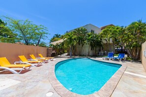 Enjoy the beautiful Aruban weather outside! Take a dip and cool off in the pool!