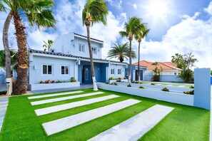 The outdoor landscape with well painted facade and trees is very soothing to the eyes.