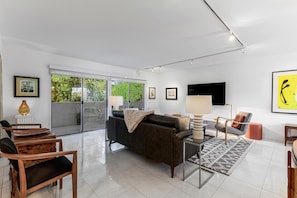 Living room with 64" HDTV and plenty of seating