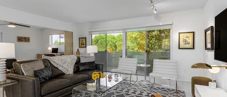 Living room shown with optional accordion wall open for maximum space