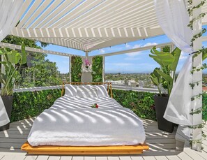 Retreat to the outdoor bed for a poolside siesta
