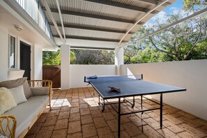 Covered outdoor ping pong for endless family fun, rain or shine.