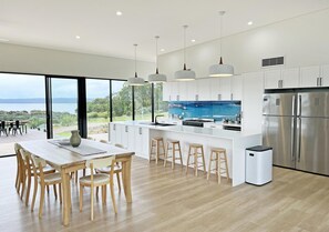 The open plan dining area and fully equipped kitchen with bar stools, room for the whole family