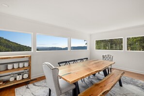 Bright dining area with bench seating to accommodate a group.