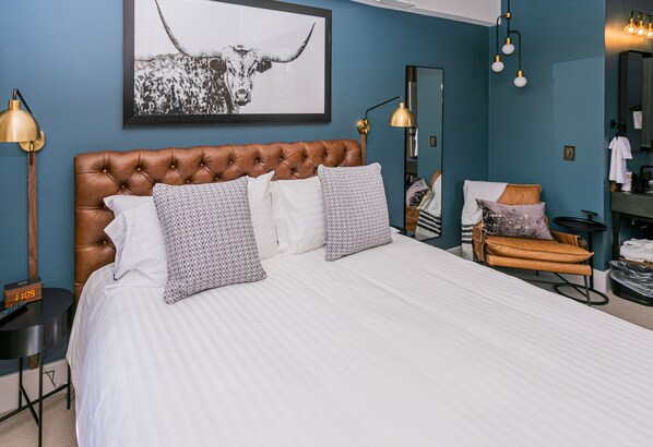 Elegant King Suite featuring a plush king-sized bed, separate living area, and premium amenities for a luxurious and relaxing stay.