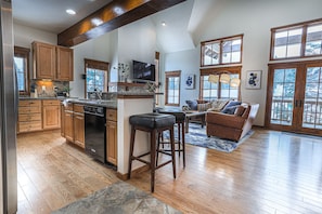 The vaulted ceiling and large windows let in lots of natural light. Gorgeous mountain views