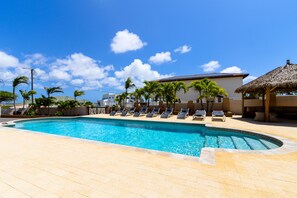 Enjoy the lap pool of this Villa with multiple chairs for guests to lie on and with a gazebo for a nice shade on a sunny day
