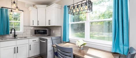 Prepare and enjoy a meal in this fully stocked kitchen/dining room.