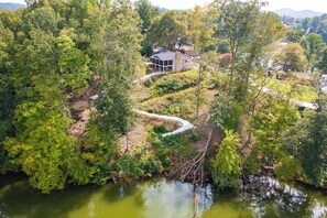 Aerial view of the house and private walking trail. 