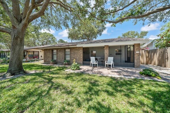 Your unit under towering oak trees. Sit and enjoy your morning coffee on the screen front porch.