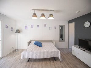 The living area features a double sofa bed.