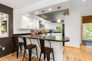 Experience the allure of our sleek black kitchen counter, where elegance meets modernity. It's the centerpiece of a culinary haven that exudes style and sophistication.