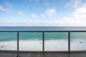 Glass rail balcony with custom tile.  