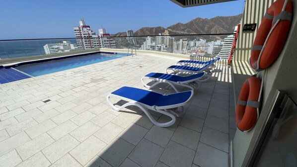 Pool, ocean view and city