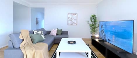 Living room with comfy sofa bed and smart TV