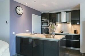 Black kitchen with all amenities