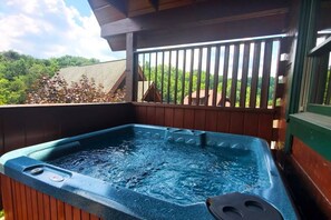 Relax in your private hot tub while sipping your favorite drink