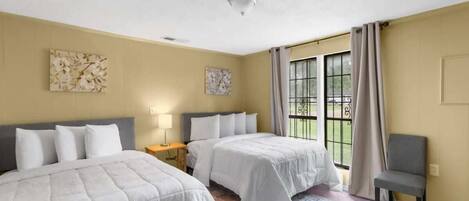 Comfortable double beds with large windows
