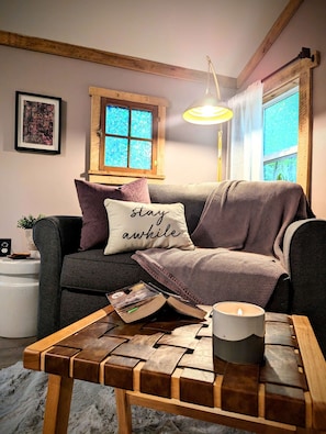 Cozy up by the wood burning stove and read a book or play a game.