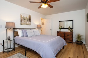 There’s no shortage of storage space with the wooden dresser and spacious closet with hangers and shelves.