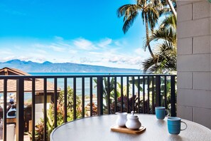 Sip your morning coffee beneath the swaying Palms