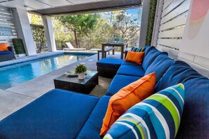Heated pool with ample seating for guests to enjoy the outdoors.