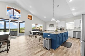 Multiple seating and dining areas including a custom live edge dining table