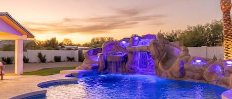 Pool - - Backyard pool complete with an exhilarating waterslide and soothing waterfalls!