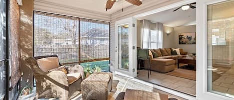 Relax in the sunroom with a book and beverage