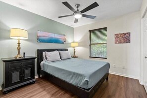 Comfortable bedroom with a fan for a great night's sleep.