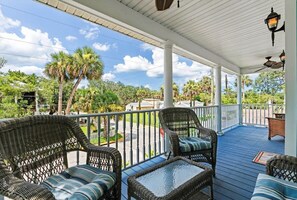 The balcony has cushioned seating