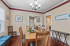 Our dining room table extends to accommodate 8 people. There are two extra chairs and storage bench seats handy nearby. This room has seen countless puzzles put together, endless competitive board games played, and huge meals consumed!