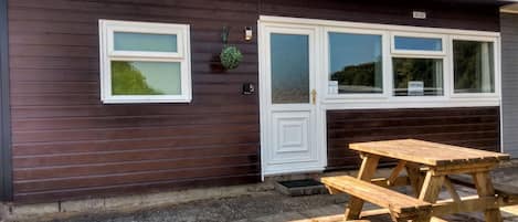 Front of chalet with own patio seating